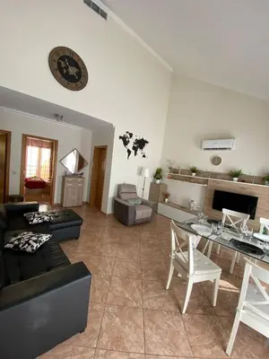 a living room with a couch and a table at Guesthouse Milagre Centro Faro in Faro