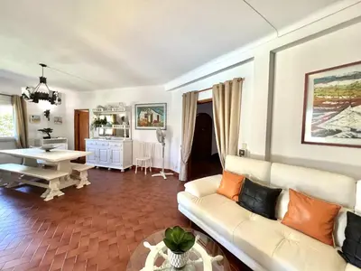 a living room with a couch and a table at Vila Rose - Private Pool by HD PROPERTIES in Vilamoura