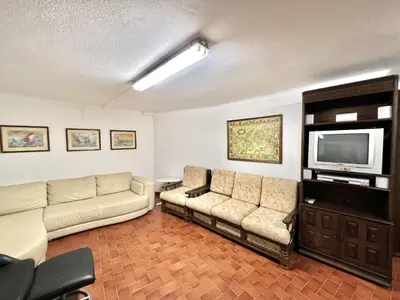 a living room with two couches and a flat screen tv at Vila Rose - Private Pool by HD PROPERTIES in Vilamoura