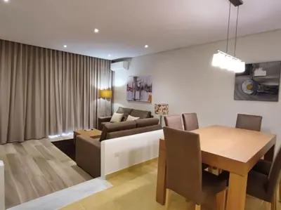 a living room with a couch and a table at Albufeira Sol Villas III by Stay ici Algarve Holiday Rental in Albufeira
