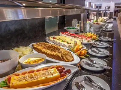 a buffet line with many different types of food at Albufeira Sol Villas III by Stay ici Algarve Holiday Rental in Albufeira
