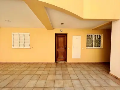 a room with yellow walls and a door and windows at Vilamoura Central 2 With Pool by Homing in Vilamoura