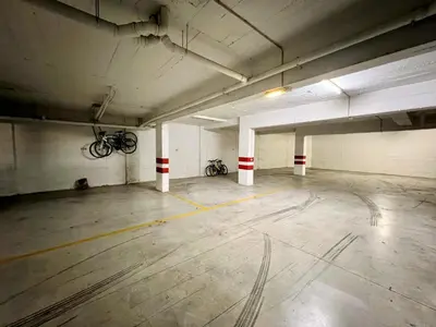 an empty parking garage with two bikes parked in it at Vilamoura Central 2 With Pool by Homing in Vilamoura