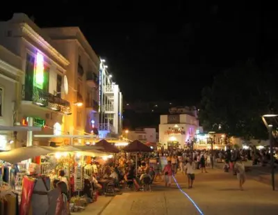 a crowd of people walking down a street at night at 1 Bed Flat - Sleeps 2 - Parking - Wifi in Albufeira