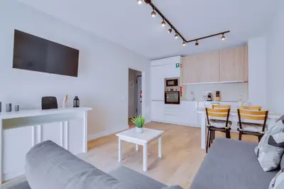 a living room with a couch and a table at AL - Apartamento Pontemira in Quarteira