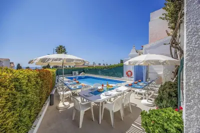 an aerial view of a town and the ocean at Villa Alegre by Villa Plus in Albufeira