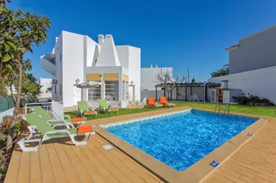 a villa with a swimming pool and a house at Villa Leonor by Villa Plus in Olhos de Água