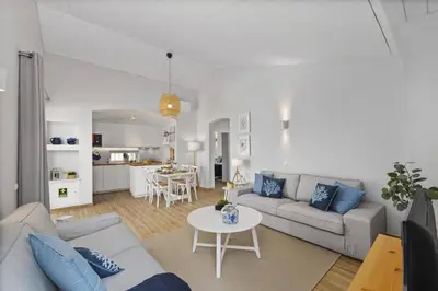 a living room with a couch and a table at Villa Lela by Villa Plus in Albufeira