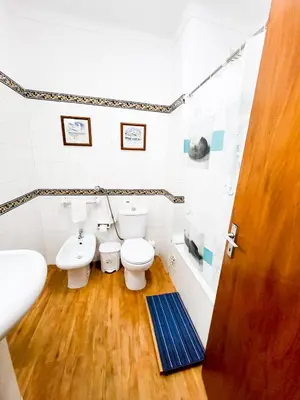 a bathroom with two toilets and a sink at T1 Tenis Golf Mar- Marina de Vilamoura- Piscina in Vilamoura