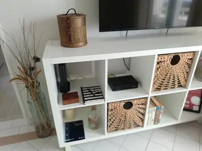 a white shelf with a tv on top of it at Apartamento 90m2 com vista mar - Albufeira in Albufeira