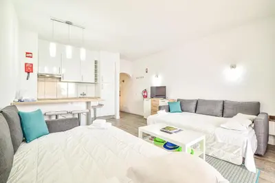 a living room with a couch and a table at SouthView Studio Silchoro AL in Albufeira