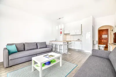 a living room with a couch and a table at SouthView Studio Silchoro AL in Albufeira
