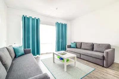 a living room with a couch and a table at SouthView Studio Silchoro AL in Albufeira