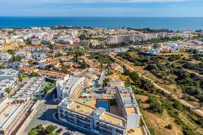 an aerial view of a city with the ocean at Solário de São José - AD by HelloVacations in Albufeira