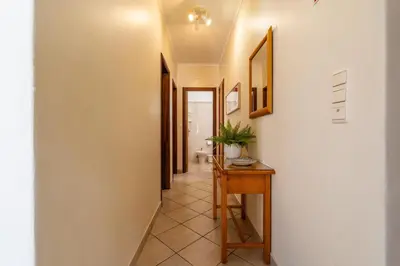 a hallway of a house with a table at Ténis Mar E in Albufeira