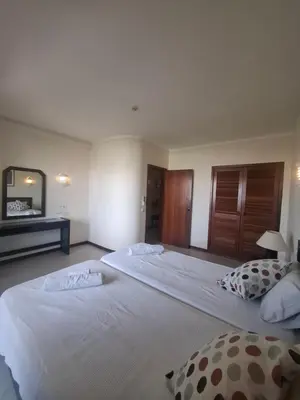 a bedroom with two beds with white sheets at Apartamento Bela Vista Tennis Club, FREE WIFI - By Algarkasa in Albufeira