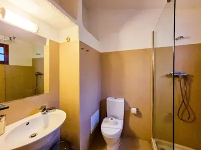 a bathroom with a toilet and a sink and a shower at FLH Balaia House with Terrace in Albufeira