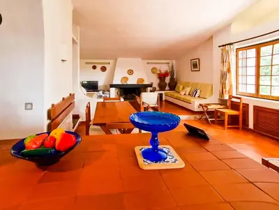 a living room with a table with a blue bowl on it at FLH Balaia House with Terrace in Albufeira