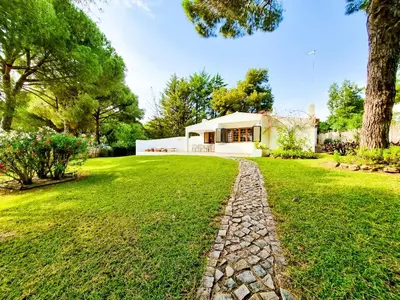 a house with a stone path in front of a yard at FLH Balaia House with Terrace in Albufeira