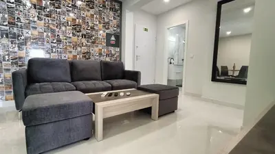 a living room with a couch and a coffee table at New Appartment! Albufeira in Albufeira