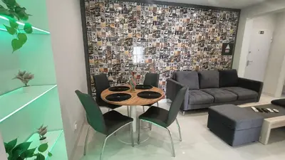 a living room with a table and a couch at New Appartment! Albufeira in Albufeira