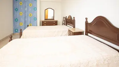 a bedroom with two beds and a mirror at Apart Quinta dos Martins - swimming pool - BY BEDZY in Albufeira