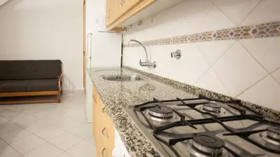 a kitchen with a stove and a sink at Apart Quinta dos Martins - swimming pool - BY BEDZY in Albufeira