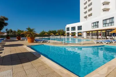 a large swimming pool in front of a building at Endless Summer in Albufeira