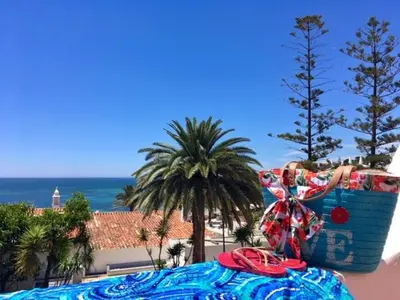a close up of a palm tree with the sky in the background at Apartamentos Borda D´Agua in Albufeira