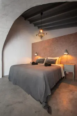 a bedroom with a large bed in a room at Suite Swimming Pool Quinta da Eira 140 years old in Loulé