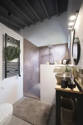 a bathroom with a sink and a toilet at Suite Swimming Pool Quinta da Eira 140 years old in Loulé