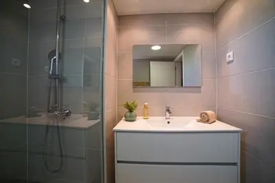 a bathroom with a shower and a sink and a shower at One Bedroom Apartment Marina View in Albufeira