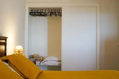 a bedroom with a bed and a mirror at One Bedroom Apartment Marina View in Albufeira