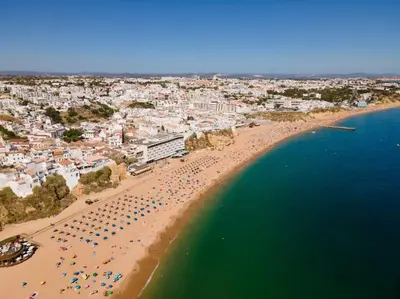 an aerial view of a beach with a crowd of people at Lovely LM Penthouse in Albufeira