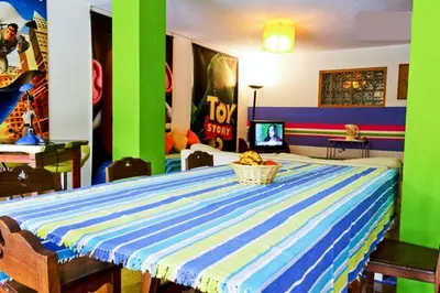 a room with a table with a bowl of fruit on it at Coloured Studio in Faro