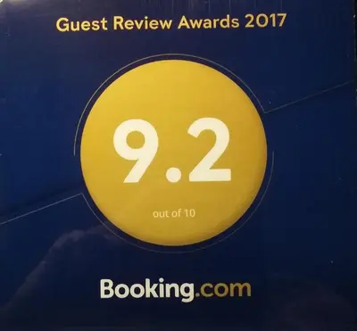 a yellow sign that says guest review awards at Coloured Studio in Faro