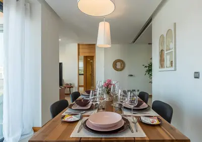a dining room with a wooden table and chairs at Algarve Vale Lobo Golf&Beach with Private Pool I in Vale do Lobo