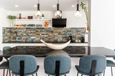 a dining room with a table and chairs at Privilege Deluxe Apartment Casa Mãe, Faro in Faro