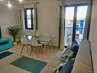 a living room with a couch and a glass table at Old Town Oasis 110m to Beach, AC & 2 Bathrooms by Vou de Férias in Albufeira