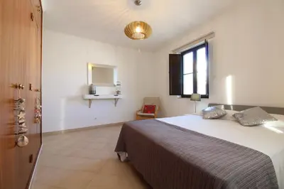 a bedroom with a large bed and a window at Old Town Oasis 110m to Beach, AC & 2 Bathrooms by Vou de Férias in Albufeira