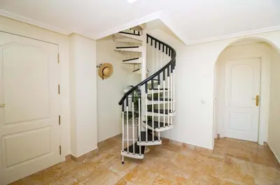 a staircase in a home with white walls at Apartment Pine View- Falesia Beach By Dalma Portuguesa in Albufeira