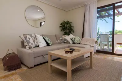 a living room with a couch and a table at Apartment Pine View- Falesia Beach By Dalma Portuguesa in Albufeira