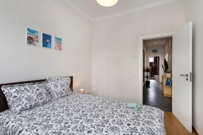 a bedroom with a bed and a hallway at Lemon Hostel Faro in Faro