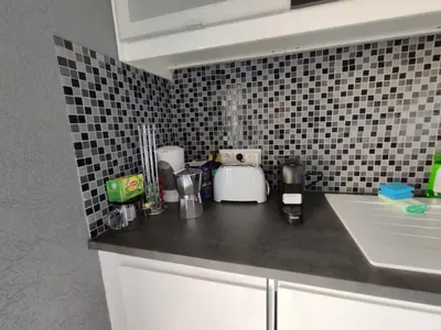 a kitchen with a counter top with a blender at Casa das Oliveiras o seu refugio no Algarve in Quarteira