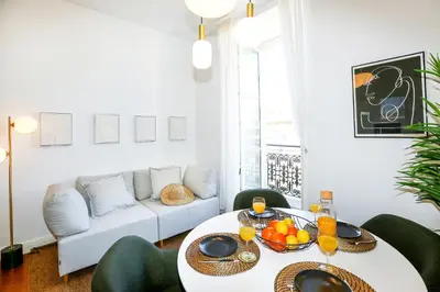 a living room with a table and a couch at Offline Mood Apartment in Faro