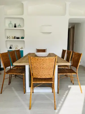 a dining room with a wooden table and chairs at Amazing - VillaAnas Balaia in Albufeira