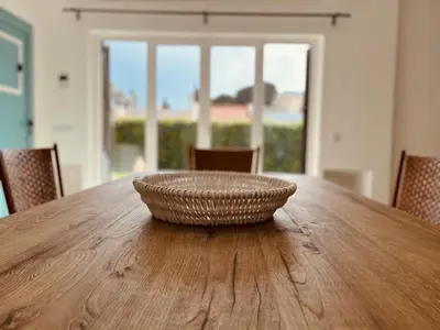 a bowl sitting on top of a wooden table at Amazing - VillaAnas Balaia in Albufeira