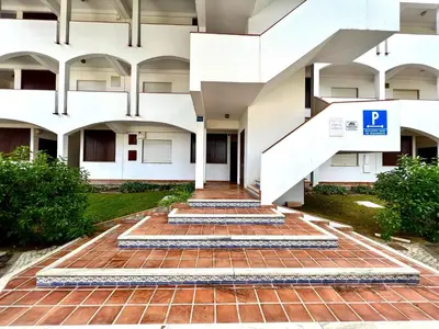 a building with stairs in front of it at Albufeira Cosy by Homing in Albufeira