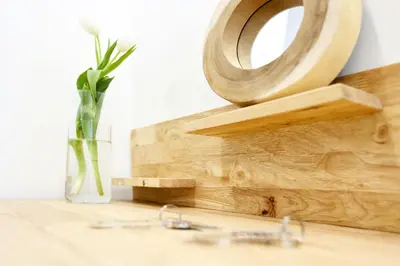a vase with a flower and glasses on a table at Ice Cream Call Apartments in Faro