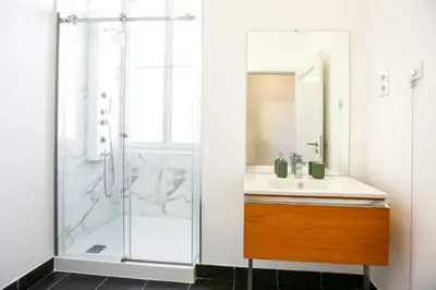 a bathroom with a shower and a sink at Ice Cream Call Apartments in Faro